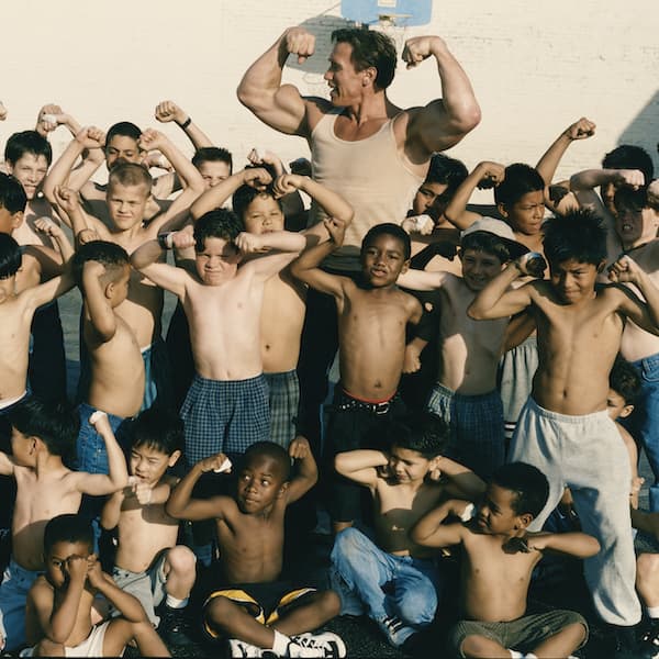 Arnold posing with kids