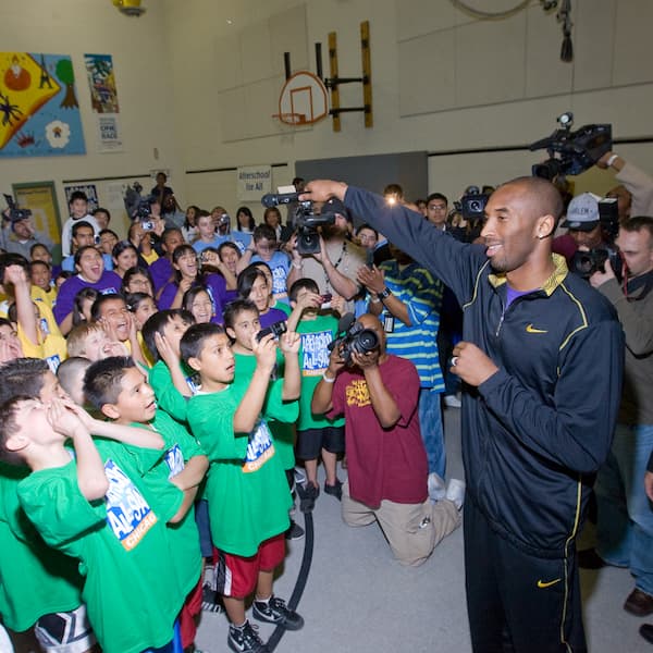 Kobe Bryant in gym with students