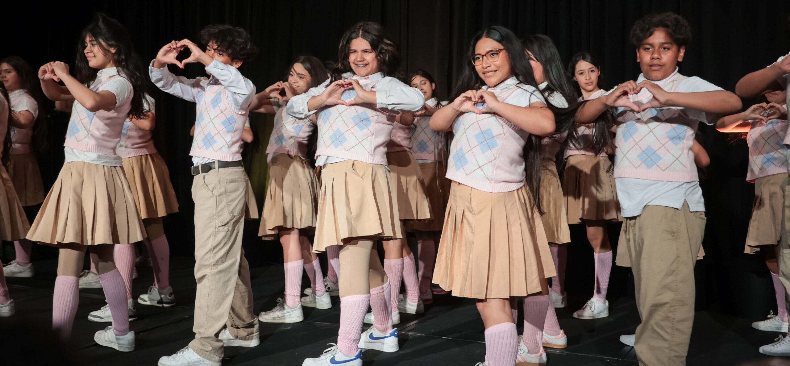 Students dancing on a stage